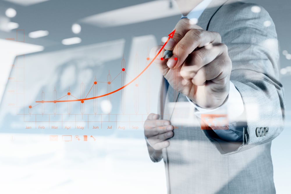 double exposure of businessman hand drawing virtual chart business on touch screen computer-Dec-19-2025-12-51-01-2126-PM